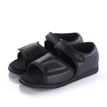 Black orthopedic sandals with adjustable velcro straps.