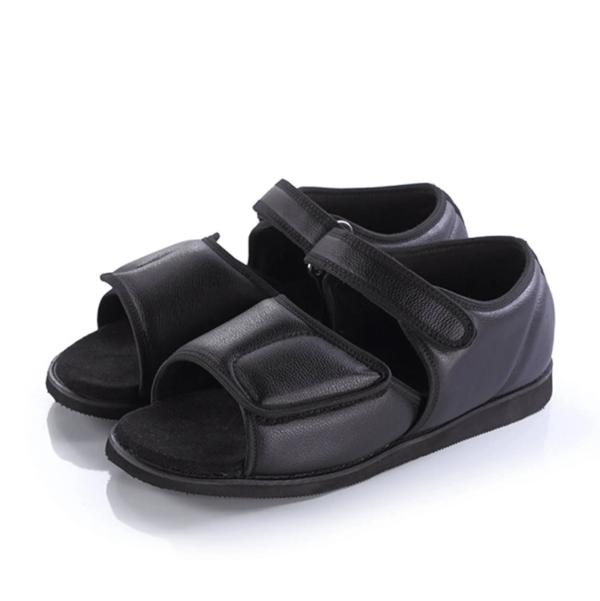 Black orthopedic sandals with adjustable velcro straps.