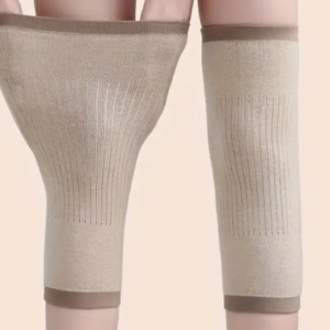 Beige compression knee sleeves on human legs