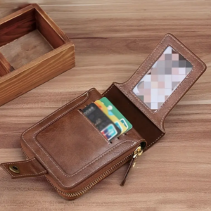 An open brown leather wallet resting on a wooden surface.