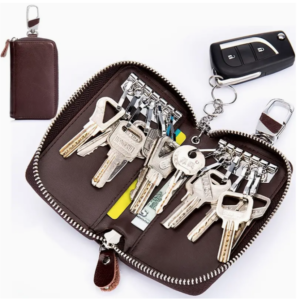 Leather key case with multiple keys and car remote.