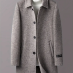 Grey overcoat with white sweater on display