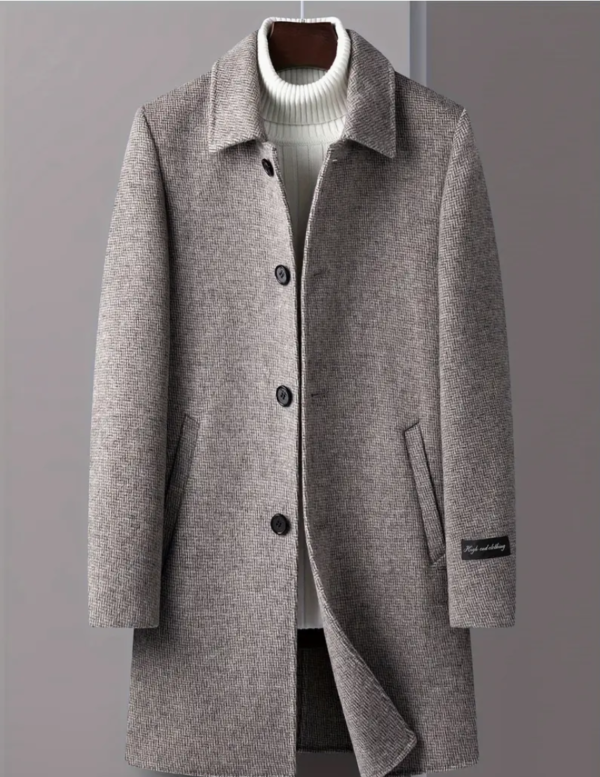 Grey overcoat with white sweater on display