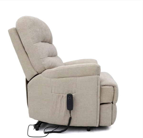 Beige electric recliner chair with remote control.